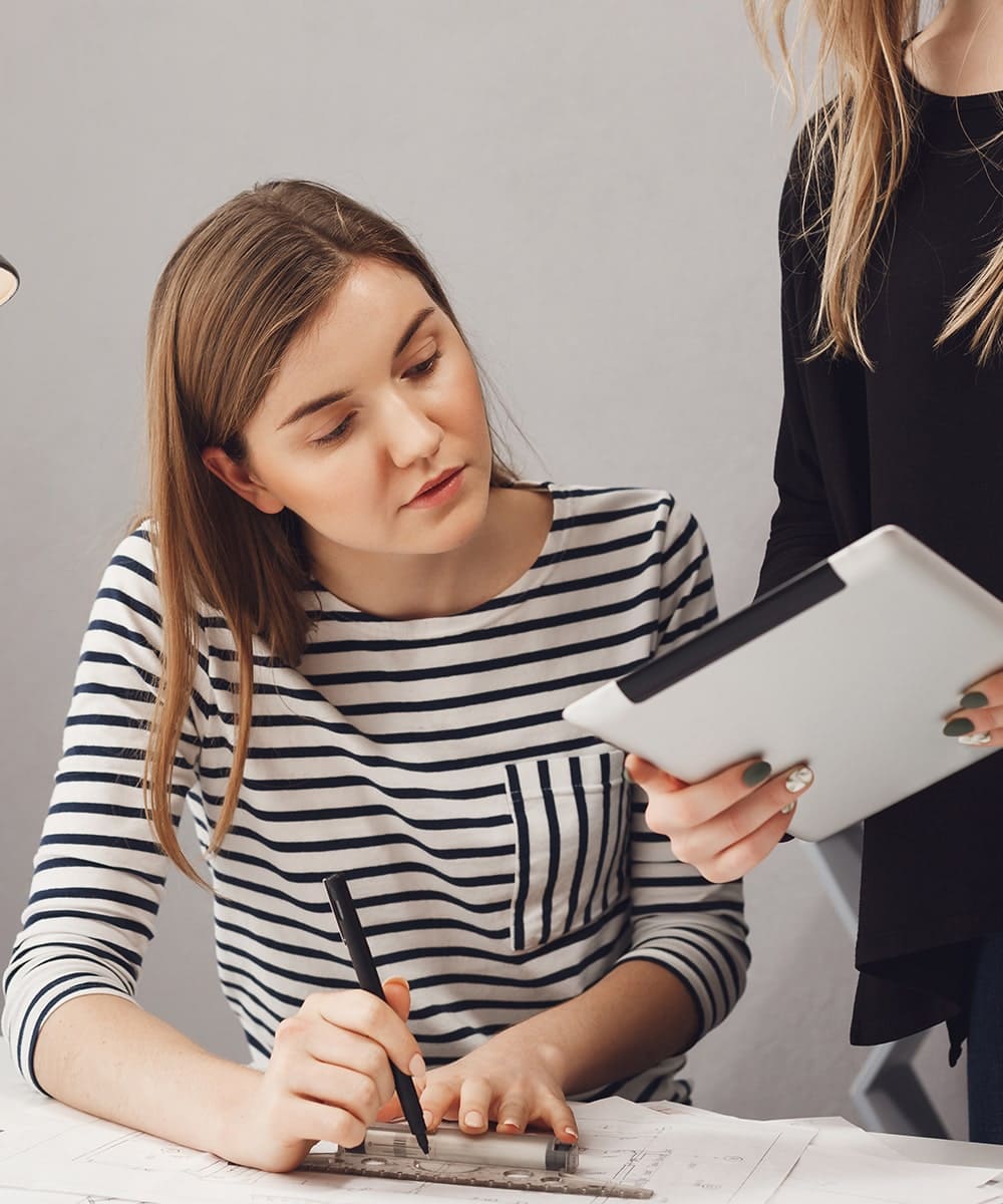 Fashion designer drawing on tablet